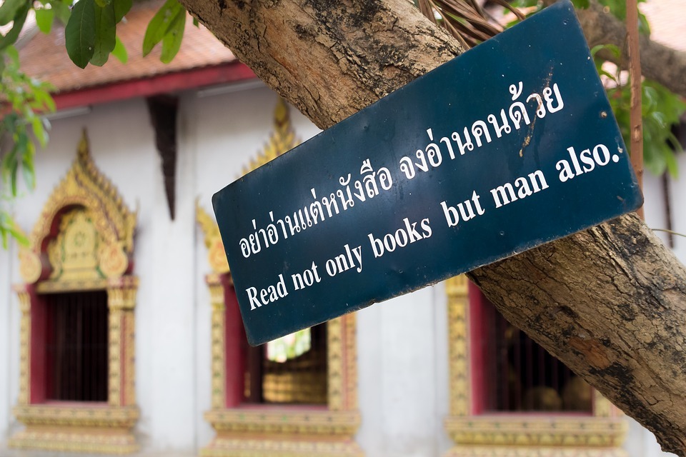 a proverb written in Thai and translated to English