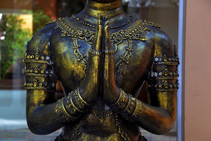 a brass Buddhism statue