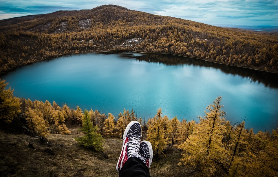 showing off shoes with beautiful scenery