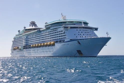 A cruise ship sailing on calm water