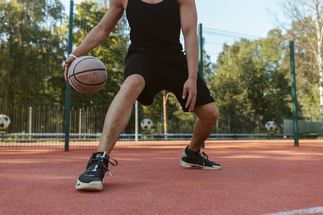A person dribbling a basketball
