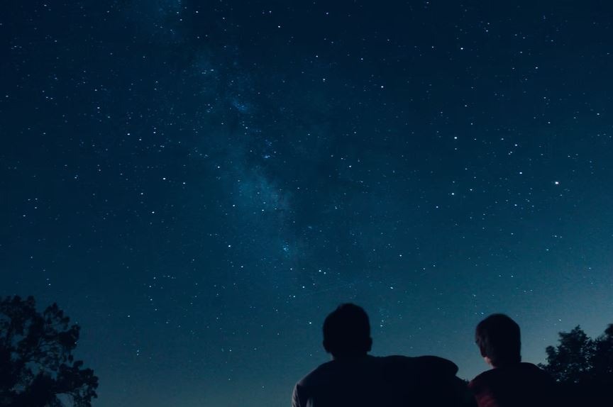 Two people under the stars